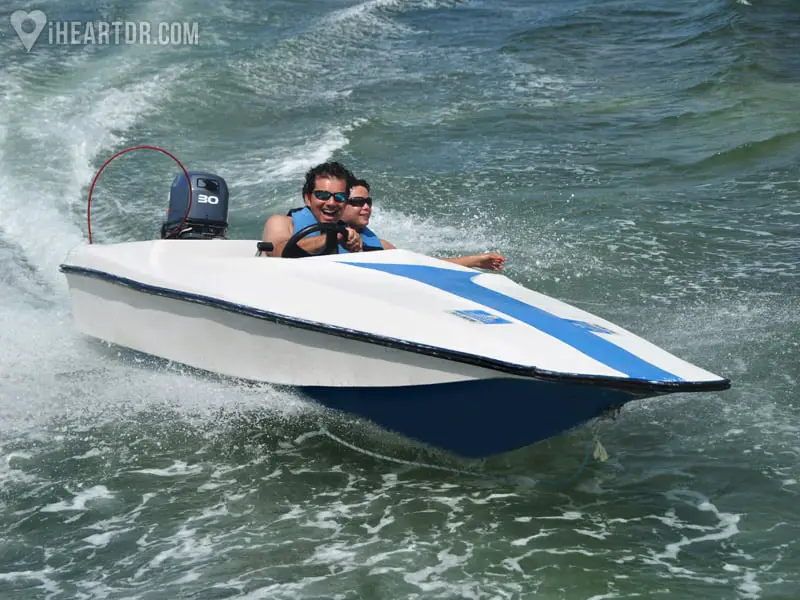 Couple driving a speedboat