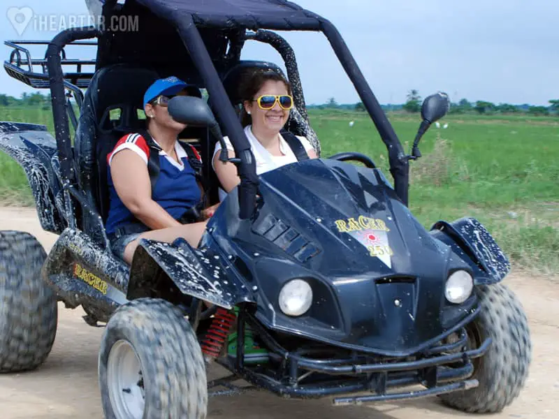 Two women on a black buggy