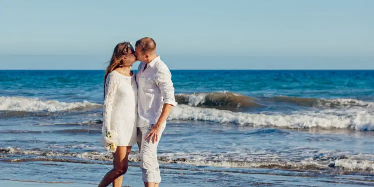 Couple kissing at the beach