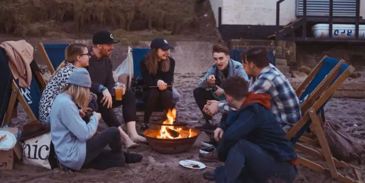 Group of people around camp fire